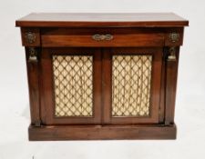 19th century mahogany side cabinet in the Empire-style, comprising a frieze drawer over two cupboard