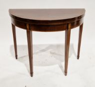 Early 19th century mahogany demi-lune foldover card table, the hinged top with a satinwood