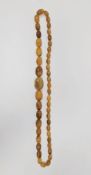 Butterscotch amber style bead necklace comprising a single row of 45 graduating beads, approximately