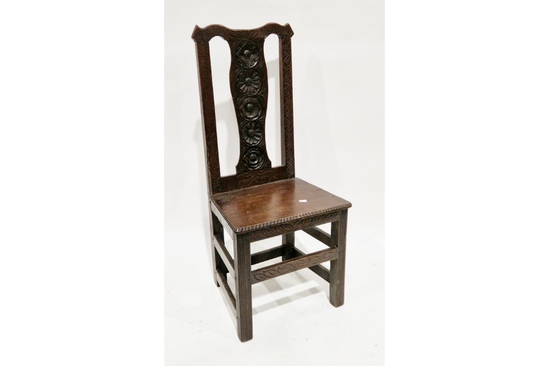 Oak side chair in the 17th century manner, the back with central splat carved with flowers and