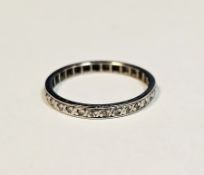 White metal eternity ring with illusion set small diamonds, size N, approximate weight 2.0 grams