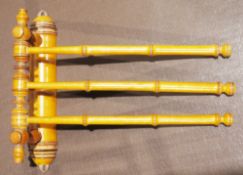 Late 19th/early 20th century satinwood wall hanging three-branch adjustable towel rail of faux