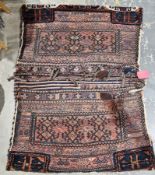 Eastern red ground saddle back, each half with six hooked lozenges, geometric and stylised animal