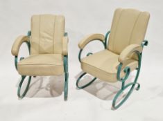 Pair of Art Deco open armchairs with cream leather-effect upholstered back, seat and elbow rests, on