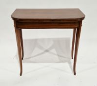 Edwardian mahogany string inlaid and crossbanded fold-over card table, the rectangular top with