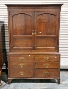 18th century oak housekeeper's cupboard, the upper section with moulded cornice over two moulded