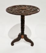 Chinese hardwood pedestal table, the circular top with relief carving of a dragon within clouds