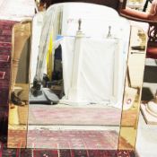 Pair of Art Deco wall mirrors of cloud form, comprising a central clear mirrored panel flanked