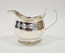 George III silver cream jug, London 1810, maker's mark rubbed, of plain form with reeded rim and