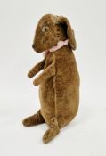 Early to mid-20th century velvet toy rabbit, with stitched eyes, nose and mouth, wearing a pink