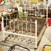 Late 19th/early 20th century brass and white painted iron double bedstead, on castors, 150cm high