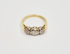 18ct yellow gold and diamond ring, with a row of three collet set diamonds, largest approximately