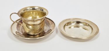 George V silver cup and saucer, Birmingham 1932, W I Broadway & Co, both of plain form, the cup with