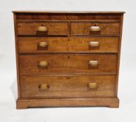 Early 20th century oak chest of drawers, the rectangular top with thumb-mould edge over a walnut