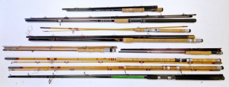 Nine fishing rods in rod bags including two Taylor Johnson ' The Dorchester ' 2 piece rods, Apollo