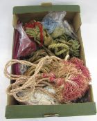 One box of curtain ties and tassels, in sizes, including burgundy damask silk tie-backs, an early