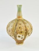 Geoffrey Swindell (b. 1945) A porcelain vase of swollen lobed form, with narrow foot and pinched
