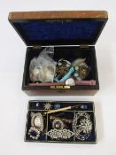 Late 19th / early 20th century brown tooled leather covered jewellery box containing a quantity of