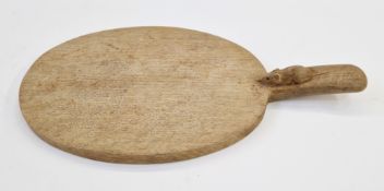 Robert 'Mouseman' Thompson, oak oval bread board, the handle carved with signature mouse, 39.5cm