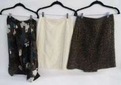 Tweed skirt labelled Mulberry, cream wool skirt labelled Prada and a silk floral patterned bell