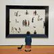 Chris Chapman (Contemporary) Oil on board Woman and dog looking at a L S Lowryish (Lowry) - Image 1 of 3