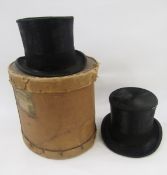 Two vintage top hats, one with the royal crest stamped inside and the other labelled Scott & Co