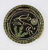 Paul Young (b.1961) Studio pottery circular dish, with slip glazed decoration of a rabbit, unsigned,