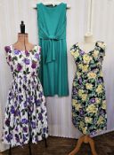 11 various vintage dresses to include a white cotton sleeveless sundress printed with purple