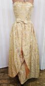 1950's brocade strapless evening gown with full overskirt, bow detail to the waist and yellow