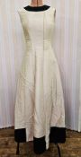 A cream satin fitted evening gown labelled Elizabeth Arden London, sleeveless, a full 'A' line skirt
