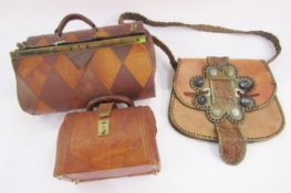 Small leather Gladstone-style bag, another Gladstone-style bag with chequered lozenge design, and