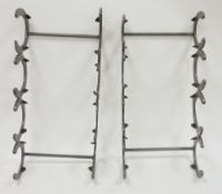 Two wall-mounted towel racks constructed from horseshoes and rebar (2)