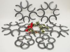Five wreaths constructed from horseshoes and two similar trivets (7)