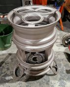 Outdoor firepit/stove made from car wheels and horseshoes with aluminium pan