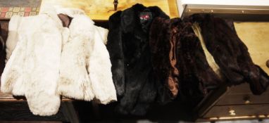 One black fur jacket, two fur coats and a vintage fur cape (4)  Condition Report Only one coat has