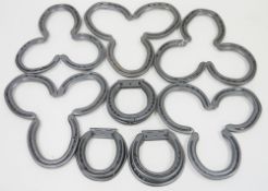 Three door knockers comprised of horseshoes and five similar trivets (8)