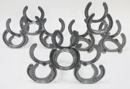 Three wine racks constructed from horseshoes (3)