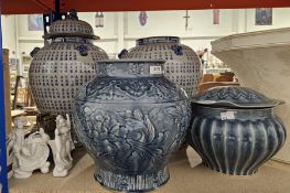 Pair of blue and white Chinese character decorated lidded jars, lids with Dog of Fo finials, a