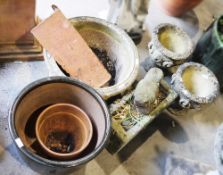 Collection of reconstituted stone garden planters of various shapes and sizes including a large