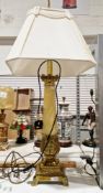Large classical style lamp, the base and top in brass with a central column, in marble-effect resin