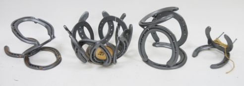 Seven single bottle holders and a fruit bowl, all constructed from horseshoes (8)