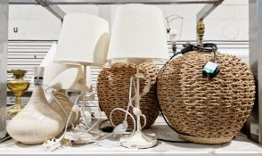 Two metal leaf decorated table lamps and a similar standard lamp, a pair of spherical shaped woven