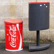 Black and red corner waste paper bin raised on stand, 74cm high with a large Coca Cola storage can