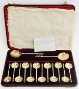 Late 19th/early 20th century cased silver plate apostle spoon set, comprising two serving spoons,