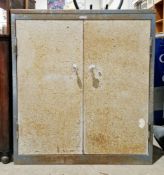 Mid-century industrial metal cabinet by Sheer Pride, having two doors opening to a shelf, 101cm high