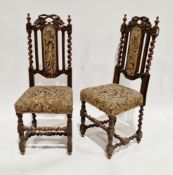 Pair of 19th century carved oak dining chairs, the top rails carved with leaves and berries,