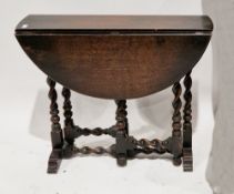 Early 20th century oak oval gateleg table on barleytwist and block supports, 70cm high x 80cm long x