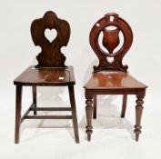 Victorian mahogany hall chair, the circular back with shield-shaped splat, solid seat, on turned
