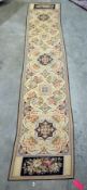 Large cream ground runner with five floral flowerhead shaped medallions, multiple geometric