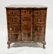 Walnut and crossbanded chest of drawers in the Queen Anne manner, of serpentine outline, the